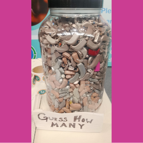 Recycled donated hearing aids all in a jar